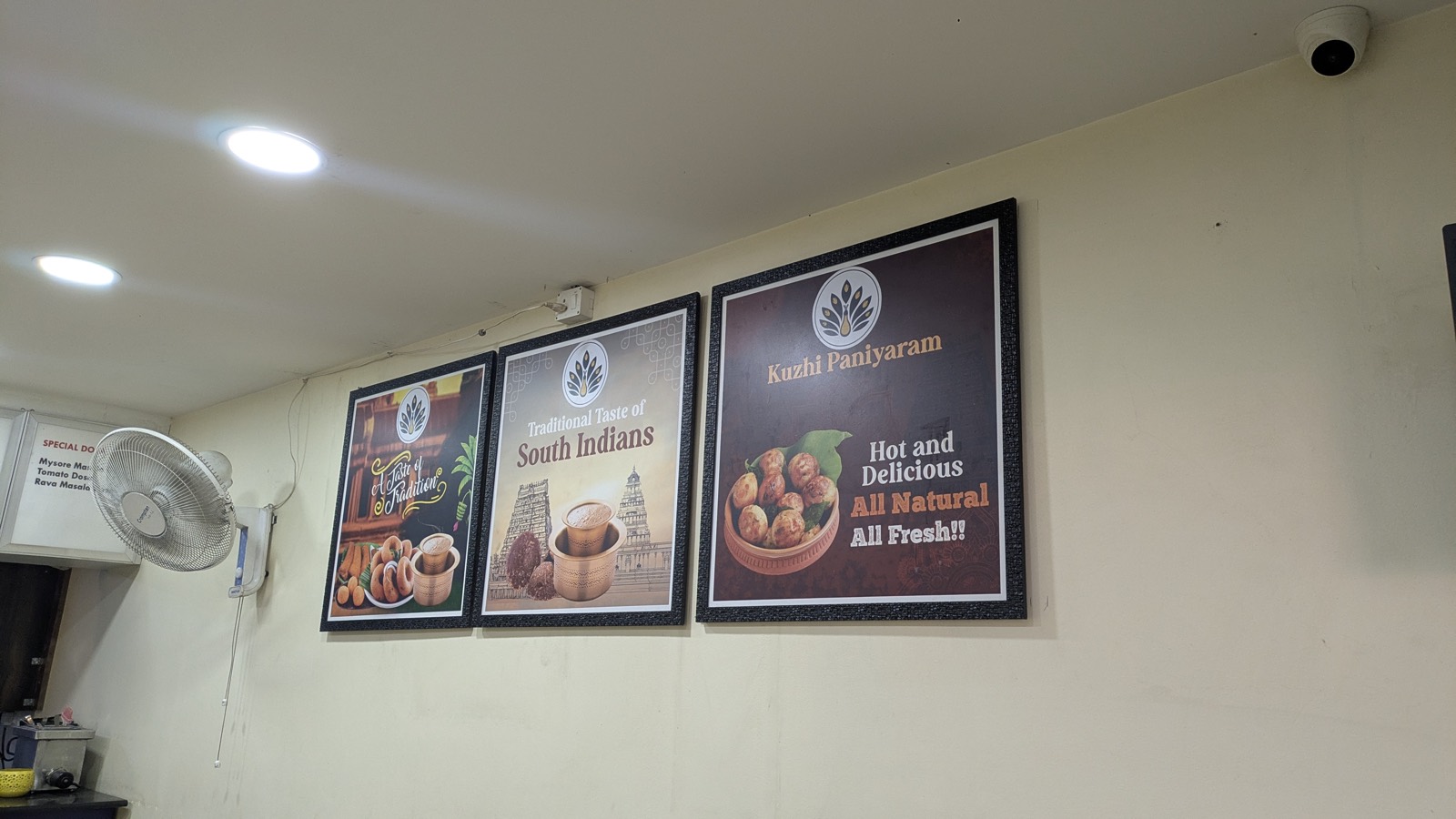 Menu posters at Brew Nest, a pure veg cafe in Koramangala, Bangalore